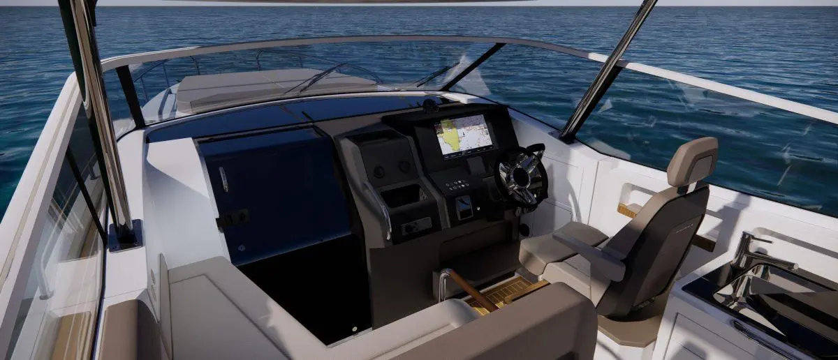 Interior view of a modern boat cockpit featuring a steering wheel, navigation screen, and plush seating. Ocean visible outside.